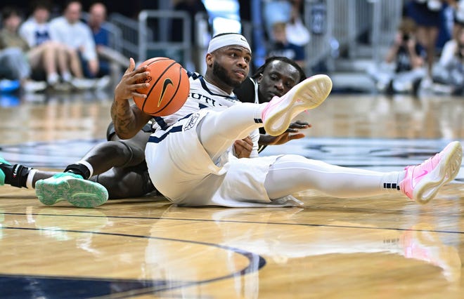 Feb 10, 2024; Indianapolis, Indiana, USA; Butler Bulldogs guard Posh Alexander (5) recovers a loose ball in front of Providence Friars guard Garwey Dual (3) during the first half at Hinkle Fieldhouse. Mandatory Credit: Robert Goddin-USA TODAY Sports