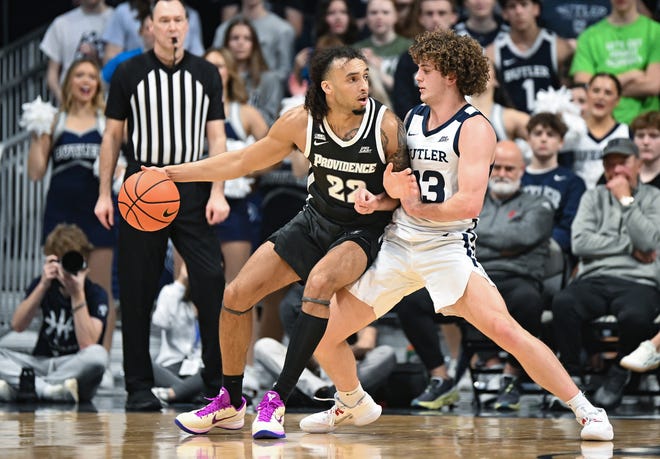 Feb 10, 2024; Indianapolis, Indiana, USA; Providence Friars guard Devin Carter (22) dribbles against Butler Bulldogs guard Finley Bizjack (13) during the first half at Hinkle Fieldhouse. Mandatory Credit: Robert Goddin/USA TODAY Sports, file