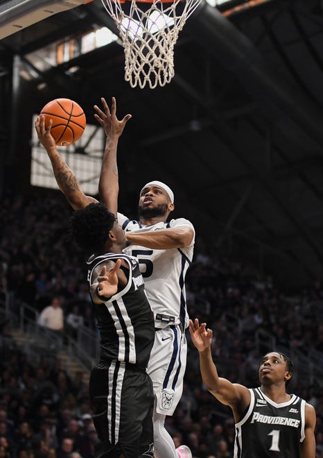 Feb 10, 2024; Indianapolis, Indiana, USA; Butler Bulldogs guard Posh Alexander (5) goes to the basket against Providence Friars guard Davonte Gaines (0) during the first half at Hinkle Fieldhouse. Mandatory Credit: Robert Goddin-USA TODAY Sports