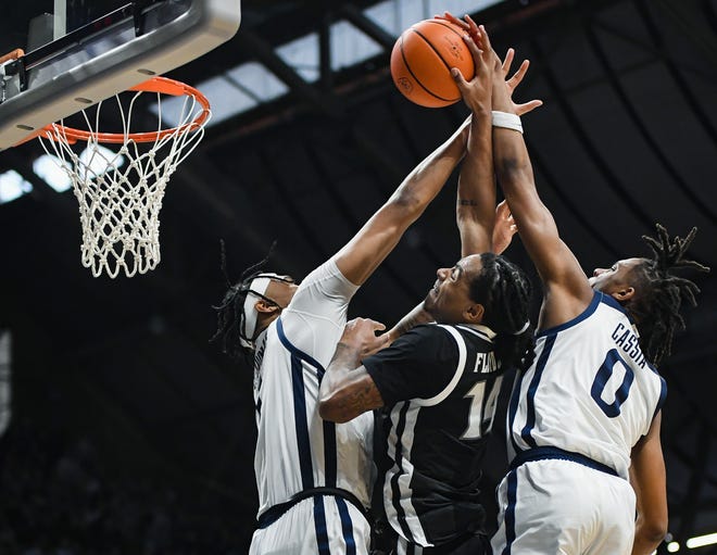 Feb 10, 2024; Indianapolis, Indiana, USA; Butler Bulldogs forwards Jalen Thomas (1) and Augusto Cassia (0) combine for the game-clinching block of Providence Friars guard Corey Floyd Jr. (14) during the second half at Hinkle Fieldhouse. Mandatory Credit: Robert Goddin-USA TODAY Sports