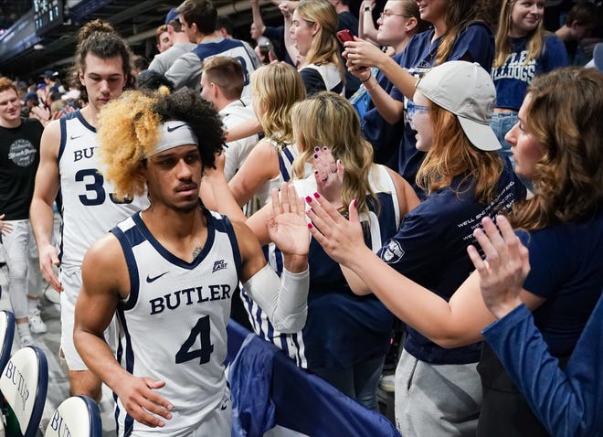 Feb 10, 2024; Indianapolis, Indiana, USA; Butler Bulldogs guard DJ Davis (4) celebrates with the student section after defeating the Providence Friars at Hinkle Fieldhouse. Mandatory Credit: Robert Goddin-USA TODAY Sports