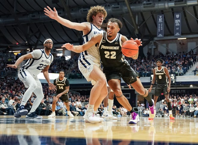 Feb 10, 2024; Indianapolis, Indiana, USA; Providence Friars guard Devin Carter (22) dribbles against Butler Bulldogs guard Finley Bizjack (13) during the second half at Hinkle Fieldhouse. Mandatory Credit: Robert Goddin/USA TODAY Sports