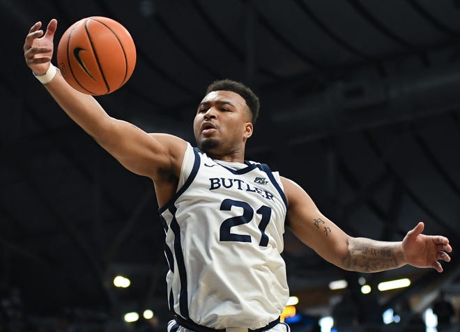 Feb 10, 2024; Indianapolis, Indiana, USA; Butler Bulldogs guard Pierre Brooks (21) rebounds the ball against the Providence Friars during the second half at Hinkle Fieldhouse. Mandatory Credit: Robert Goddin-USA TODAY Sports