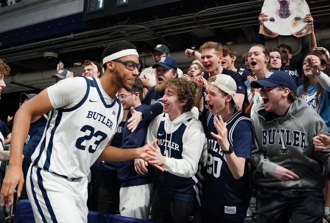 Feb 10, 2024; Indianapolis, Indiana, USA; Butler Bulldogs center Andre Screen (23) celebrates with the student section after defeating the Providence Friars at Hinkle Fieldhouse. Mandatory Credit: Robert Goddin-USA TODAY Sports