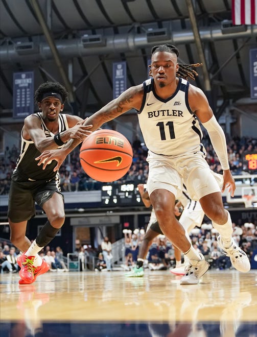 Feb 10, 2024; Indianapolis, Indiana, USA; Providence Friars guard Davonte Gaines (0) and Butler Bulldogs guard Jahmyl Telfort (11) run for the ball during the first half at Hinkle Fieldhouse. Mandatory Credit: Robert Goddin-USA TODAY Sports